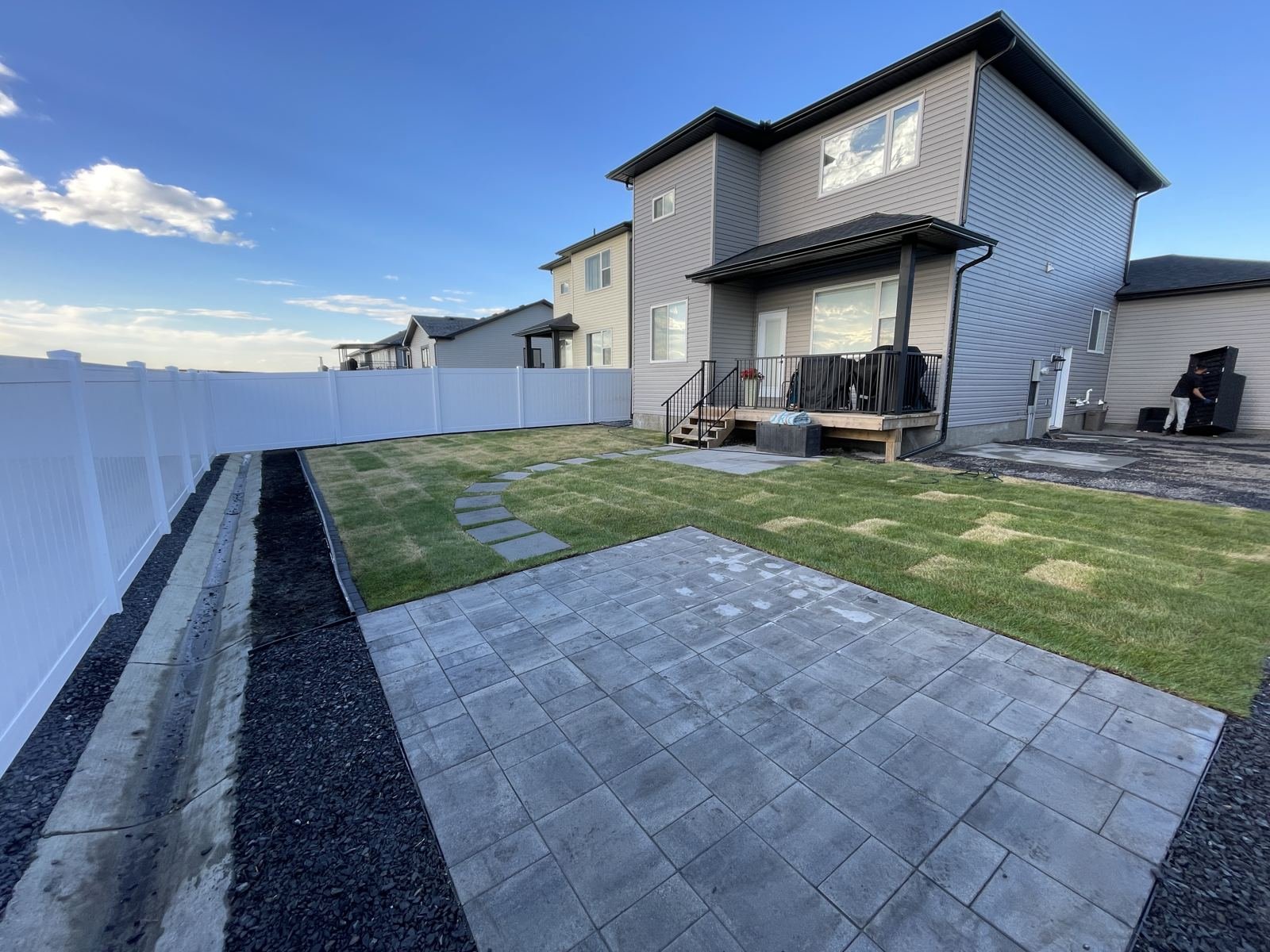 New paver stone patio and sodded backyard